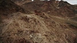 4K aerial  video of flying over and tilting to rocky slope of Hiller Mountains, Nevada Aerial Stock Footage | DCA04_073