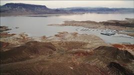 4K aerial stock footage of flying along the shore of Lake Mead with docks, Nevada Aerial Stock Footage | DCA04_093