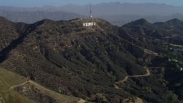 4K aerial stock footage of flying over Hollywood Hills, approaching Hollywood Sign, Los Angeles, California Aerial Stock Footage | DCA05_005