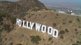 4K aerial stock footage of hovering near and then orbiting the Hollywood Sign, Los Angeles, California Aerial Stock Footage | DCA05_008
