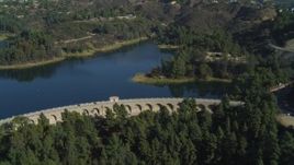 4K aerial stock footage of flying over Mulholland Dam, Hollywood Reservoir, Los Angeles, California Aerial Stock Footage | DCA05_020