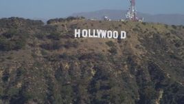 4K aerial stock footage tilt from the Hollywood Reservoir, revealing Hollywood Sign, Los Angeles, California Aerial Stock Footage | DCA05_021