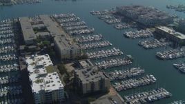 4K aerial stock footage of flying over apartment complexes and docked boats, Marina Del Rey, California Aerial Stock Footage | DCA05_073