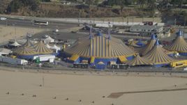 4K aerial stock footage approach Santa Monica Pier, circus tents on beach, Santa Monica, California Aerial Stock Footage | DCA05_081