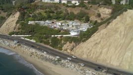 4K aerial stock footage tilt to Highway 1, along the coast, Pacific Palisades, California Aerial Stock Footage | DCA05_098