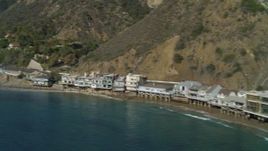 4K aerial stock footage of flying by beachfront homes, Highway 1 along the coast, Malibu, California Aerial Stock Footage | DCA05_103