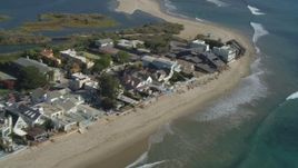 4K aerial stock footage of flying away from Malibu Lagoon to coastal homes, Malibu, California Aerial Stock Footage | DCA05_121