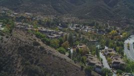 4K aerial stock footage of flying by homes on a hill, Westlake Village, California Aerial Stock Footage | DCA05_145