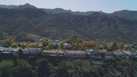 4K aerial stock footage of fly by homes on hill near Santa Monica Mountains, Westlake Village, California Aerial Stock Footage | DCA05_146