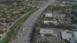 4K aerial stock footage of flying over Highway 101, tilt up, Agoura Hills, California Aerial Stock Footage | DCA05_149