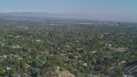 4K aerial stock footage of flying over Hidden Hills, approaching San Fernando Valley, California Aerial Stock Footage | DCA05_156