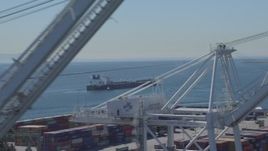 4K aerial stock footage of an oil tanker seen from cargo cranes at Port of Long Beach, California Aerial Stock Footage | DCA06_030