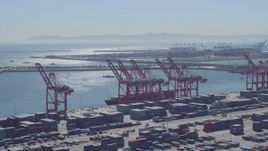 4K aerial stock footage flyby containers, cranes, cargo ship at Port of Long Beach, California Aerial Stock Footage | DCA06_040