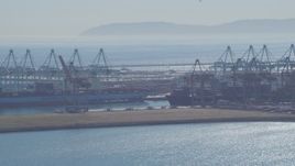 4K aerial stock footage flyby cargo ships, containers and cranes, Port of Los Angeles, San Pedro, California Aerial Stock Footage | DCA06_042