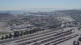 4K aerial stock footage flyby cargo containers, reveal bridge at Port of Los Angeles, San Pedro, California Aerial Stock Footage | DCA06_043