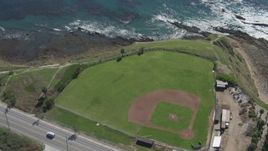 4K aerial stock footage flyby coastal road revealing Mary Star Fromhold Baseball Field, San Pedro, California Aerial Stock Footage | DCA06_049