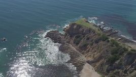 4K aerial stock footage flyby coastal cliff to reveal small cove in Rancho Palos Verdes, California Aerial Stock Footage | DCA06_051