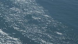 4K aerial stock footage of shimmering sunlight on the ocean in Southern California Aerial Stock Footage | DCA06_059