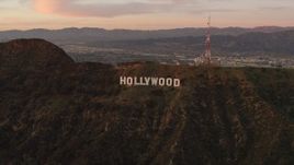 4K aerial stock footage of flying by the Hollywood Sign, Los Angeles, California, sunset Aerial Stock Footage | DCA07_002
