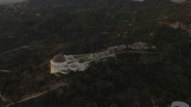 4K aerial stock footage of orbiting around the south side of the Griffith Observatory, Los Angeles, California, sunset Aerial Stock Footage | DCA07_004