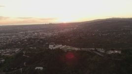 4K aerial stock footage of orbiting the east side of the Griffith Observatory, Los Angeles, California, sunset Aerial Stock Footage | DCA07_005