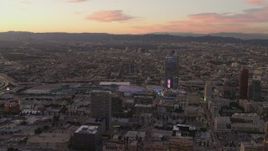 4K aerial stock footage of flying by Staples Center, The Ritz-Carlton, Downtown buildings, Los Angeles, California, sunset Aerial Stock Footage | DCA07_009