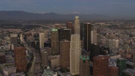 4K aerial stock footage of approaching Downtown skyscrapers, US Bank Tower, mountains in the distance, Los Angeles, California, twilight Aerial Stock Footage | DCA07_017