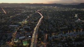 4K aerial stock footage of following Highway 101 with heavy traffic, Echo Park, California, twilight Aerial Stock Footage | DCA07_030
