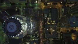 4K aerial stock footage bird's eye view flying over Westin Bonaventure Hotel, revealing Downtown skyscrapers, Los Angeles, California, night Aerial Stock Footage | DCA07_039
