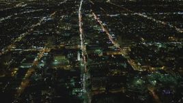 4K aerial stock footage of Wilshire Boulevard through Koreatown, Los Angeles, California, night Aerial Stock Footage | DCA07_064
