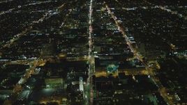 4K aerial stock footage of following Wilshire Boulevard through Koreatown, Los Angeles, California, night Aerial Stock Footage | DCA07_065