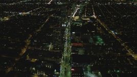 4K aerial stock footage of following Wilshire Blvd through Mid-Wilshire, Los Angeles, California, night Aerial Stock Footage | DCA07_075