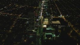 4K aerial stock footage of following Wilshire Blvd through Mid-Wilshire, Los Angeles, California, night Aerial Stock Footage | DCA07_078