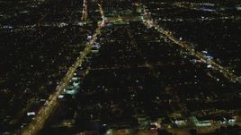 4K aerial stock footage of flying by the Beverly Center, Beverly Hills, California, night Aerial Stock Footage | DCA07_079