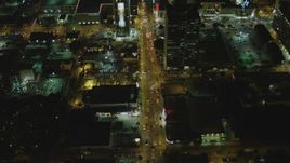 4K aerial stock footage of following Sunset Blvd, revealing Cinerama Dome, Hollywood, California, night Aerial Stock Footage | DCA07_086