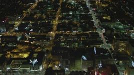 4K aerial stock footage tilt to the intersection of Hollywood Blvd and Vine Street, Hollywood, California, night Aerial Stock Footage | DCA07_087