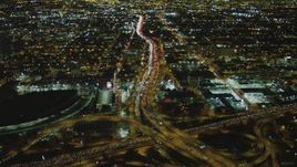 4K aerial stock footage of approaching Interstate 110 and Interstate 10 interchange, Downtown, Los Angeles, California, night Aerial Stock Footage | DCA07_110