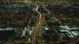 4K aerial stock footage of following Interstate 10 through Downtown Los Angeles, California, night Aerial Stock Footage | DCA07_111