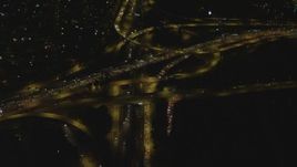 4K aerial stock footage of flying away from Highway 91 and Interstate 710 interchange, Long Beach, California, night Aerial Stock Footage | DCA07_121
