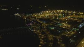 4K aerial stock footage fly over the Port of Long Beach, approaching RMS Queen Mary, Long Beach, California, night Aerial Stock Footage | DCA07_124