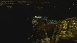 4K aerial stock footage of RMS Queen Mary, Carnival Cruise Lines building, Port of Long Beach, California, night Aerial Stock Footage | DCA07_126