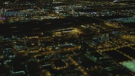 4K aerial stock footage of tracking passenger jet landing, LAX (Los Angeles International Airport), Los Angeles, California, night Aerial Stock Footage | DCA07_164