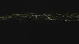 4K aerial stock footage tilt to reveal the San Fernando Valley, San Fernando Valley, California, night Aerial Stock Footage | DCA07_176