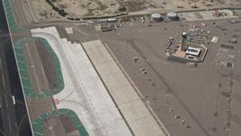4K aerial stock footage of panning across hangars and runway at San Diego International Airport, California Aerial Stock Footage | DCA08_010