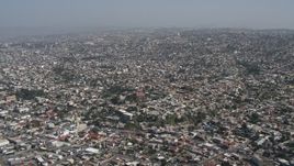 4K aerial stock footage of a view of dense urban neighborhoods in Tijuana, Mexico Aerial Stock Footage | DCA08_047