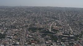 4K aerial stock footage of a view of urban residential neighborhoods in Tijuana, Mexico Aerial Stock Footage | DCA08_048
