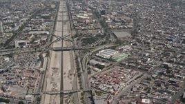 4K aerial stock footage pan from Tijuana to reveal and orbit heavy traffic on the US/Mexico Border, Tijuana Aerial Stock Footage | DCA08_049E