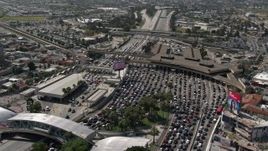 4K aerial stock footage orbit heavy traffic waiting at the US/Mexico Border, Tijuana Aerial Stock Footage | DCA08_057E