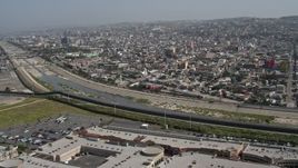 4K aerial stock footage of the border fence and Rio Tijuana, US/Mexico Border, Tijuana Aerial Stock Footage | DCA08_059