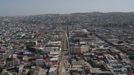 4K aerial stock footage of following a street to approach Tijuana Arch, Tijuana, Mexico Aerial Stock Footage | DCA08_060